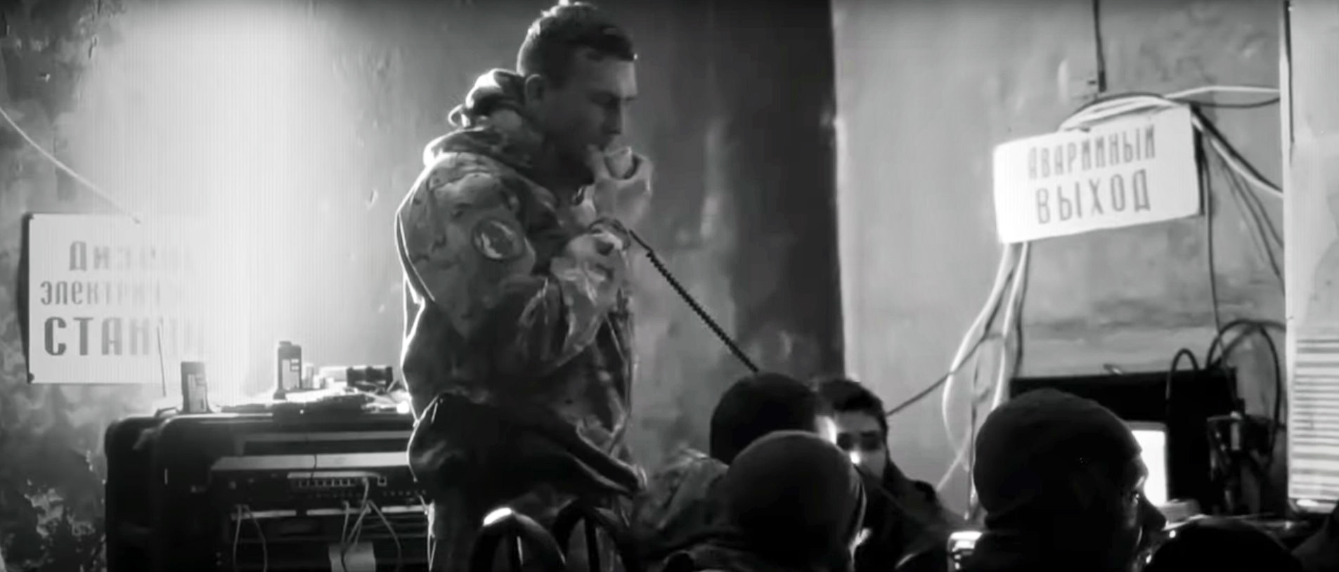 Documentary still of a soldier pausing mid-battle in the war on Ukraine.